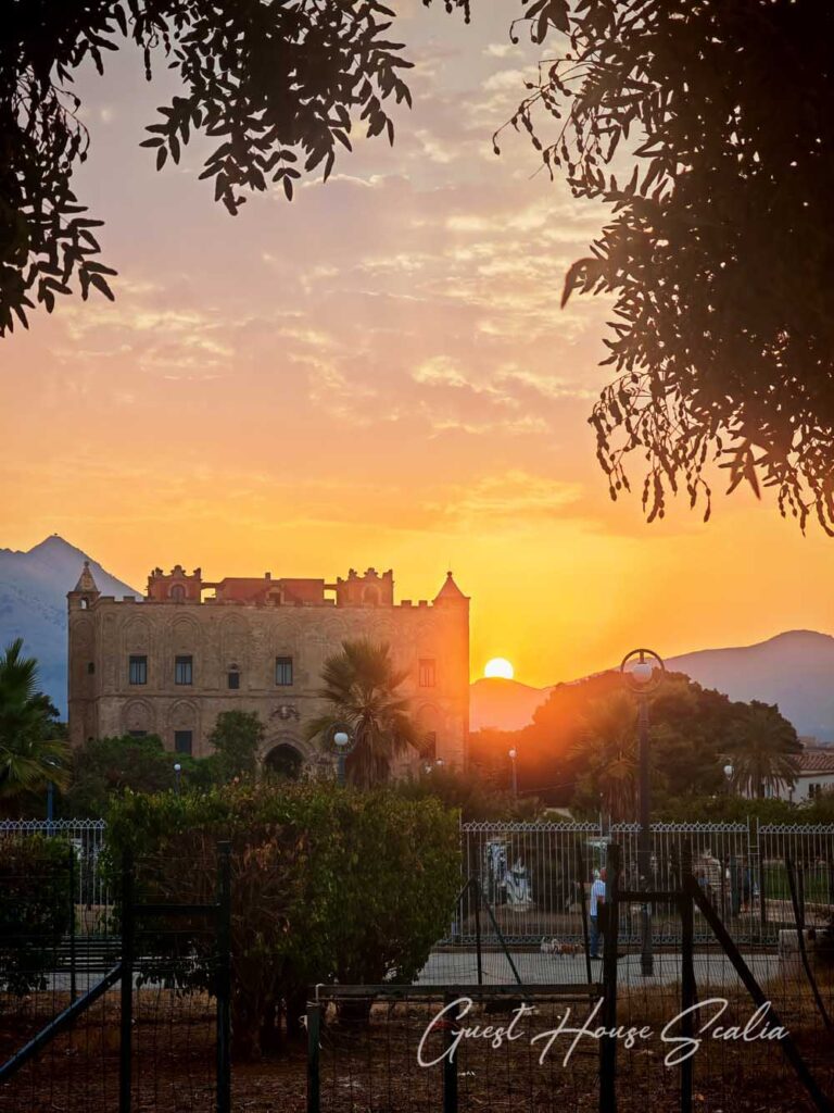 The Zisa Castle of Palermo 3 Spectacular golden sunset over the silhouette of the Zisa Castle in Palermo with a fiery orange sky.