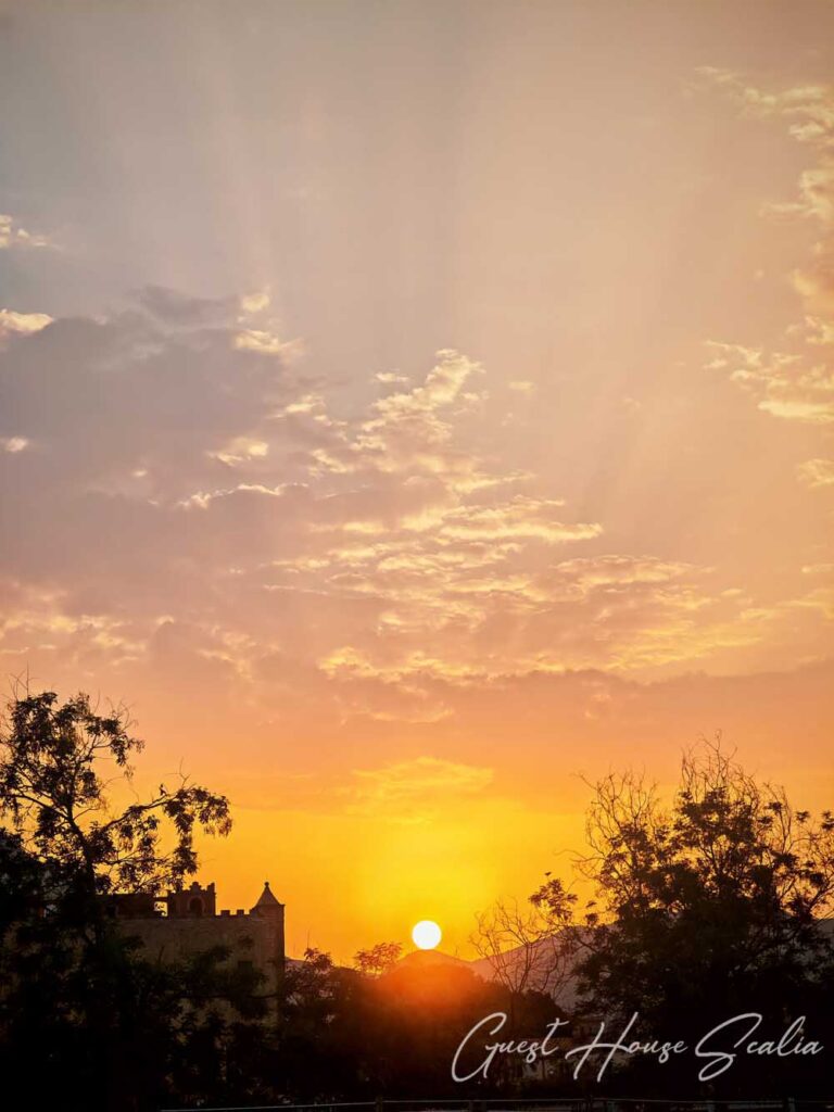 The Zisa Castle of Palermo 6 The sun setting behind the walls of the Zisa Castle, a breathtaking view available for our guests.