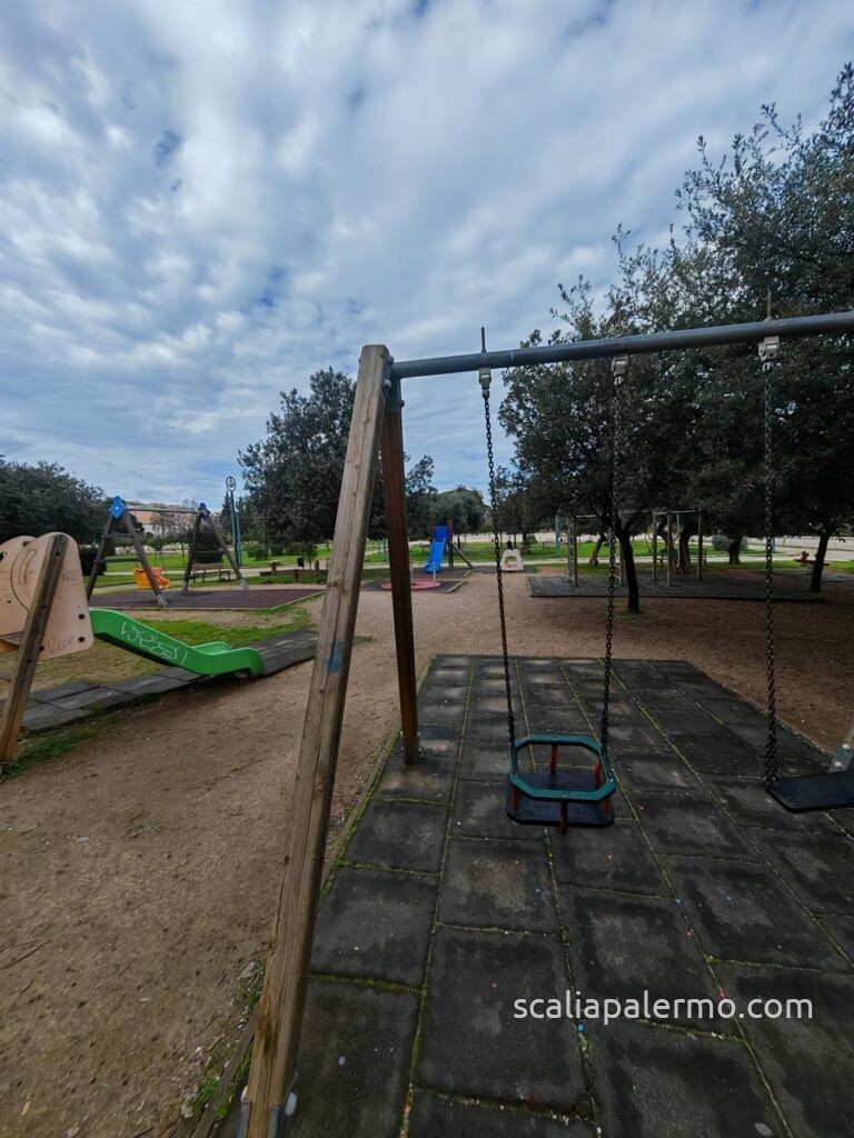 Discovering Borgo Zisa: The Green & Historical Heart of Palermo (Just Steps from Your Suite) 6 kids playground swings-family park Palermo Zisa Castle