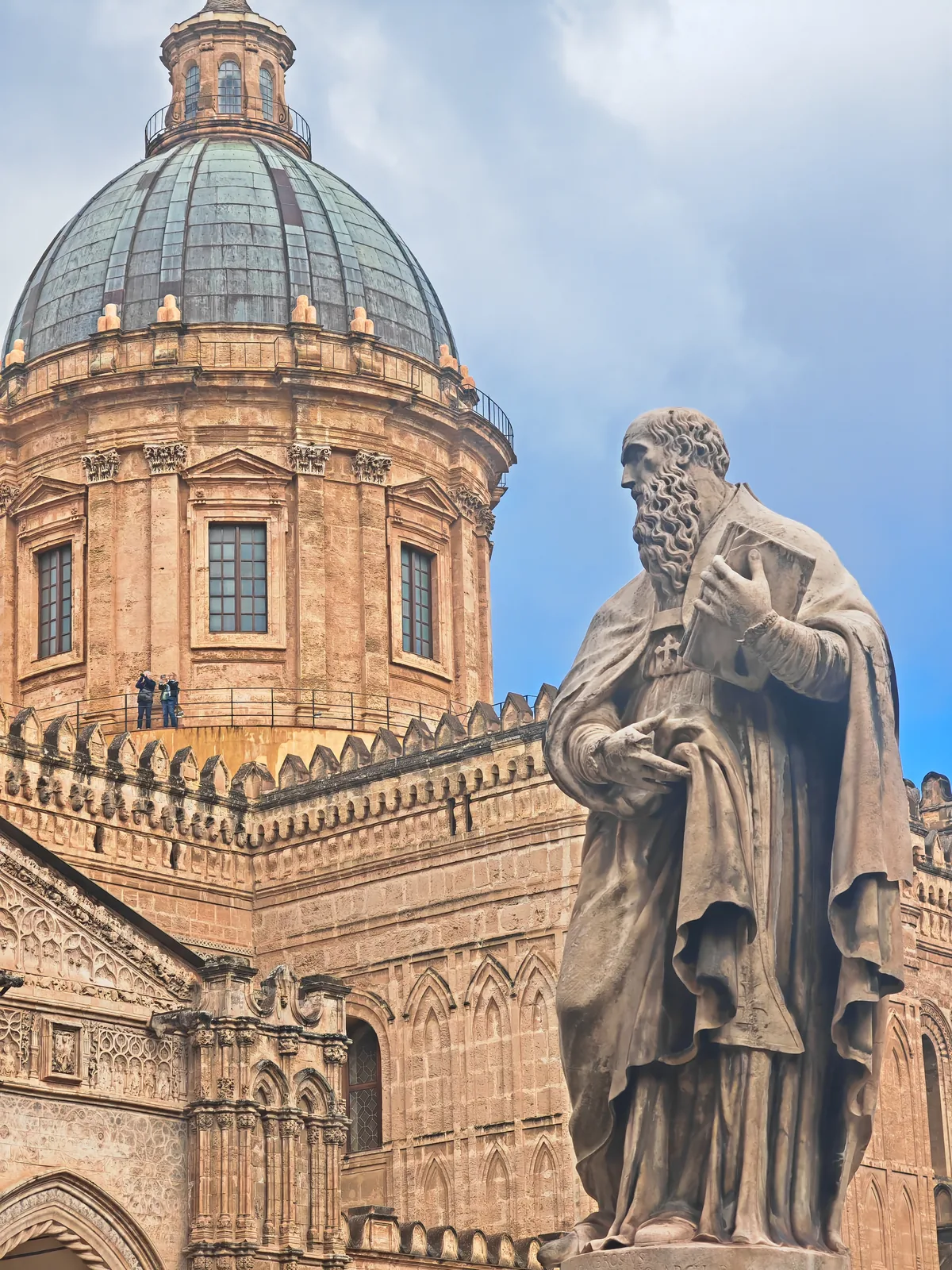 What to See in Palermo in One Day: A Walking Itinerary Through the Old Town 5 The dome of Palermo Cathedral with a statue in the foreground