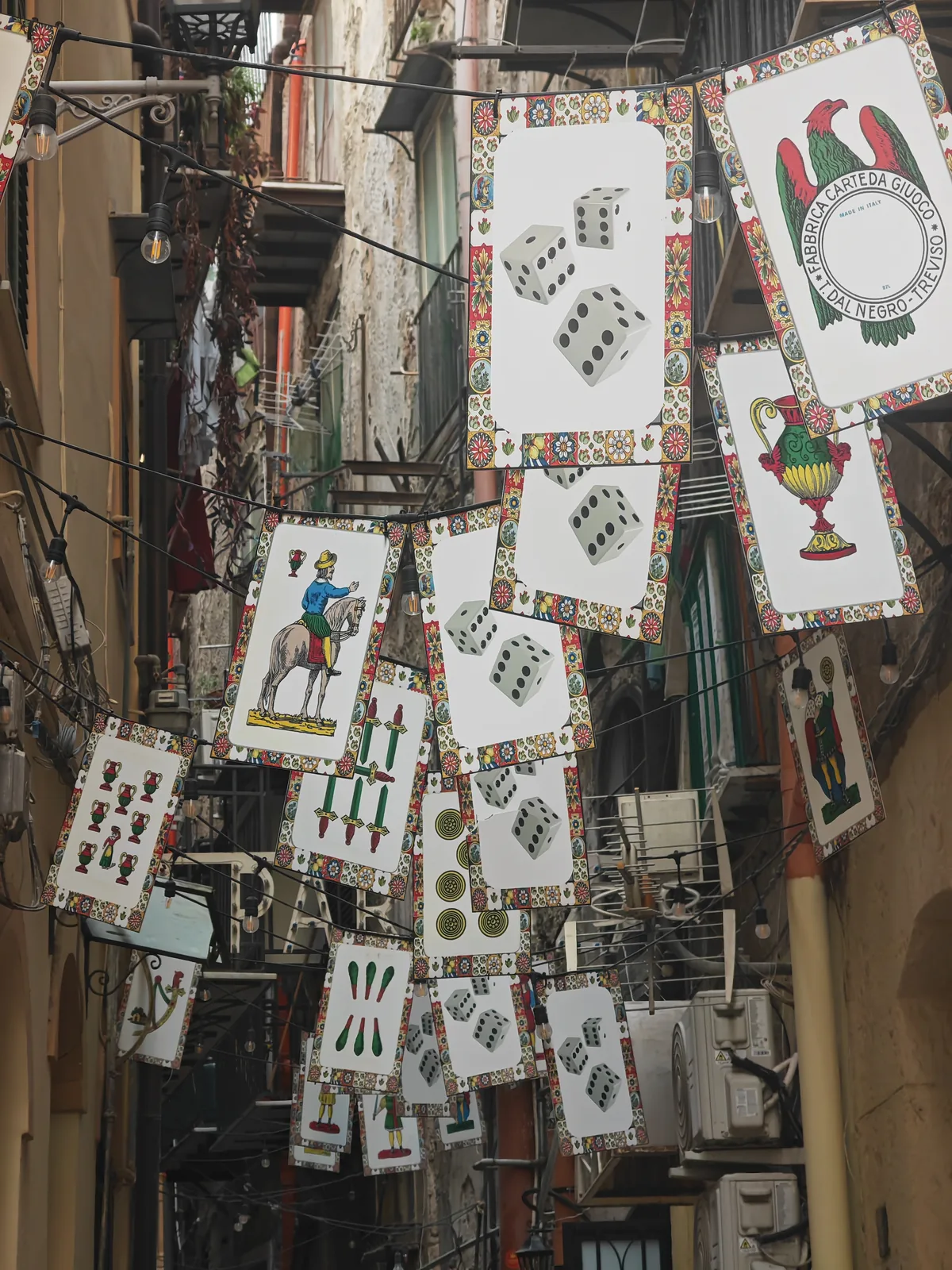 What to See in Palermo in One Day: A Walking Itinerary Through the Old Town 9 A Palermo alley decorated with giant Sicilian playing cards